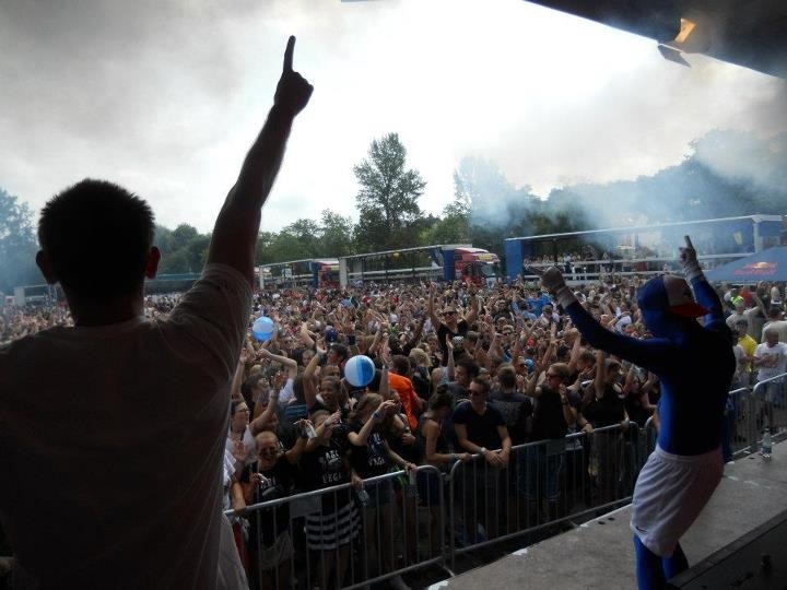 Dan Apex on stage in front of a festival crowd